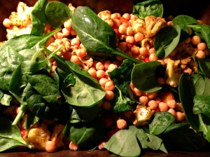 Adding baby spinach to Indian Rice Bowl