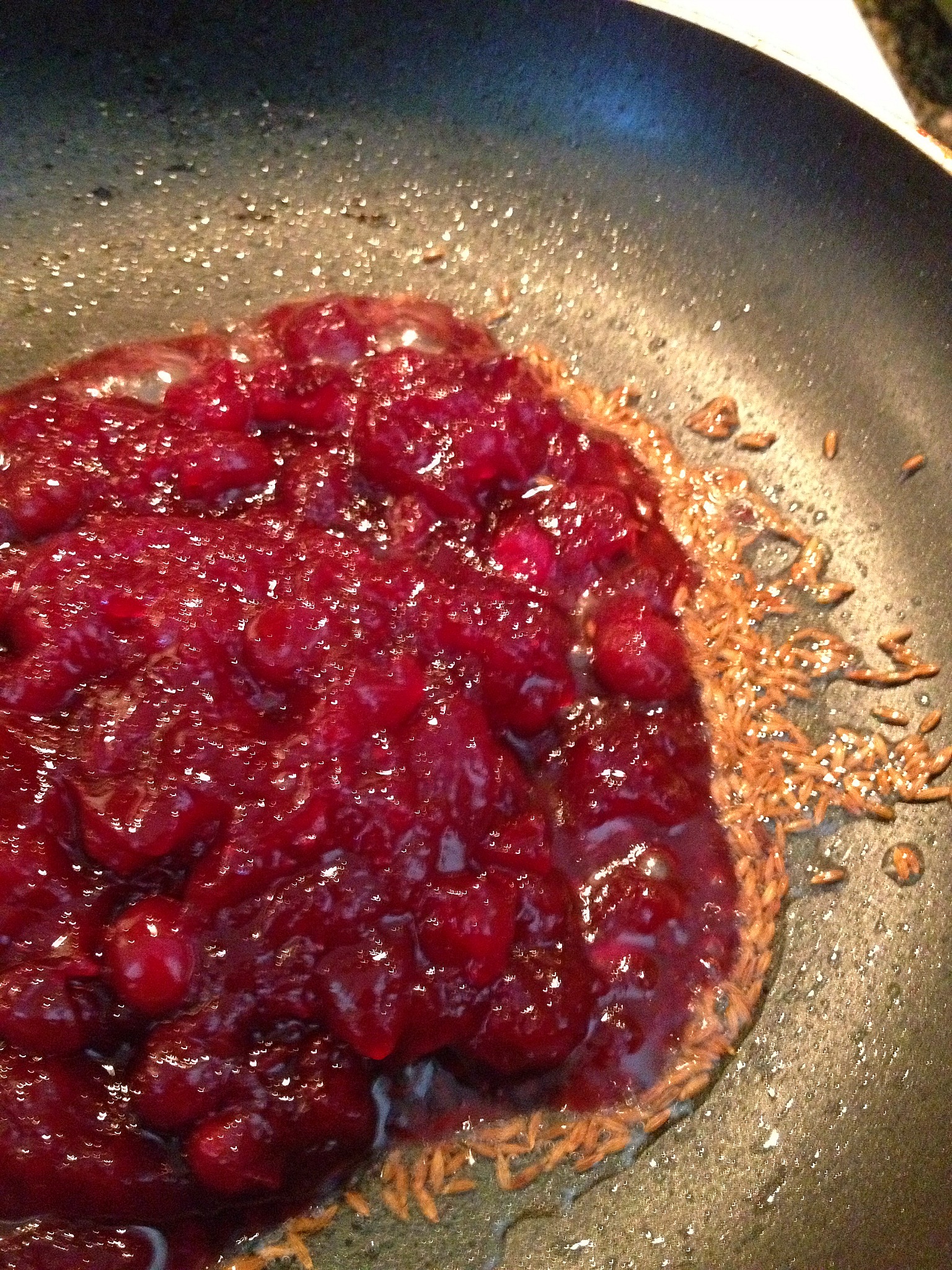 Thanksgiving leftover cranberry sauce with oil and cumin seeds