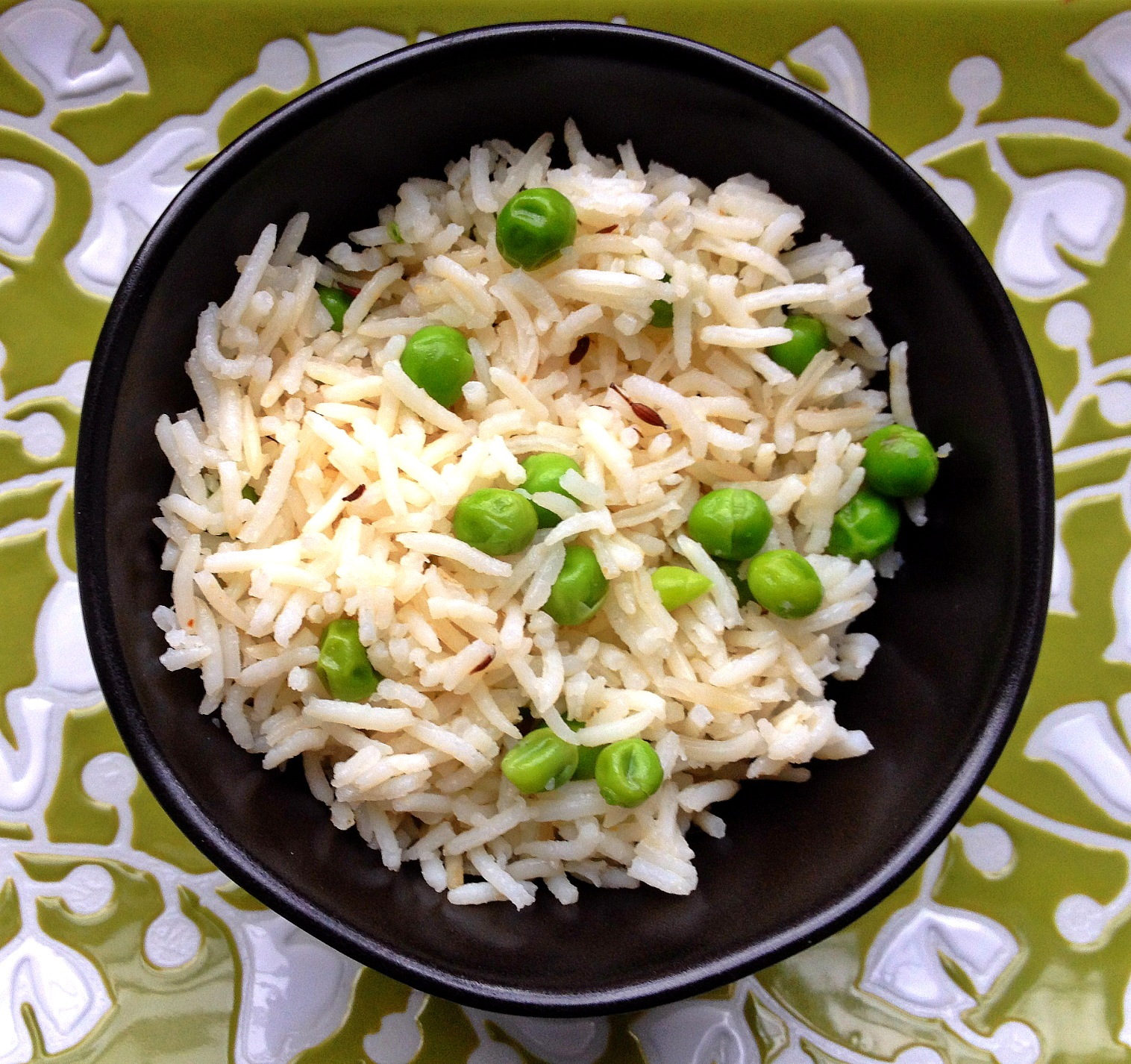 Bowl of basmati rice with green peas