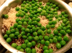 Cooked basmati rice with peas and cumin