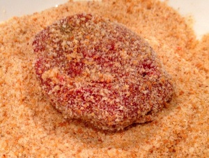 Dipping patties in eggs and breadcrumbs for vegetable cutlets