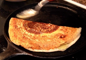 Finishing masala dosa with touch of oil or ghee