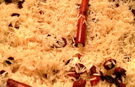 Adding basmati rice to whole spices and onions