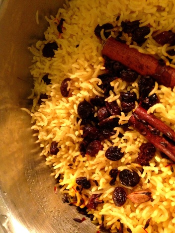 Cooking basmati rice with saffron and whole spices on the stovetop