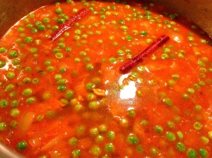 Adding frozen peas and water for Mattar Paneer