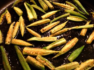 Frying okra in a non-stick skillet with canola oil