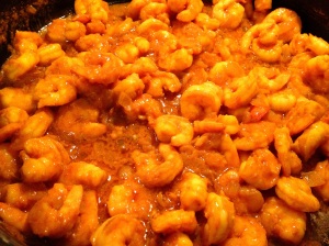 Adding cooked turmeric shrimp to skillet for Indian Shrimp Curry